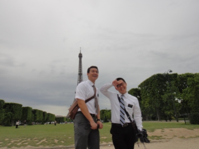 Elder Kwang (with an asian finger sign he created) and I at the Eiffel Tower